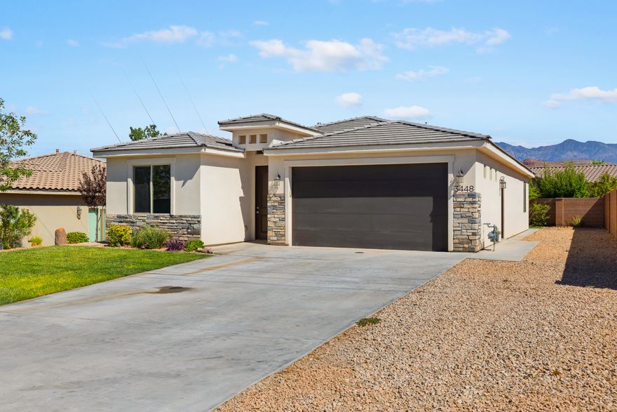 This 3-bed 2-bath home has a lot to offer. Professionally deep-cleaned, with new paint, carpet, and light fixtures, this home is refreshing. Step into the fully landscaped yard and enjoy serene, lush greenery. Enjoy easy access to Sand Hollow, Quail Lake, three golf courses, and myriad hiking and biking trails. With 14' on the side, you'll have plenty of room to park your SxS, boat, or trailer. Just be careful that your adventure doesn't make you later for dinner. Seller is a Utah real estate licensee.