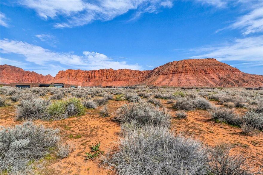 Set on a spacious .55 acre lot in Kayenta, this homesite offers breathtaking panoramic views of Southern Utah's iconic Red Mountains and surrounding desert landscape. Enjoy wide open skies, striking red rock backdrops, and the natural beauty that makes Kayenta one of the area's most sought after communities. Water impact fee has been paid!