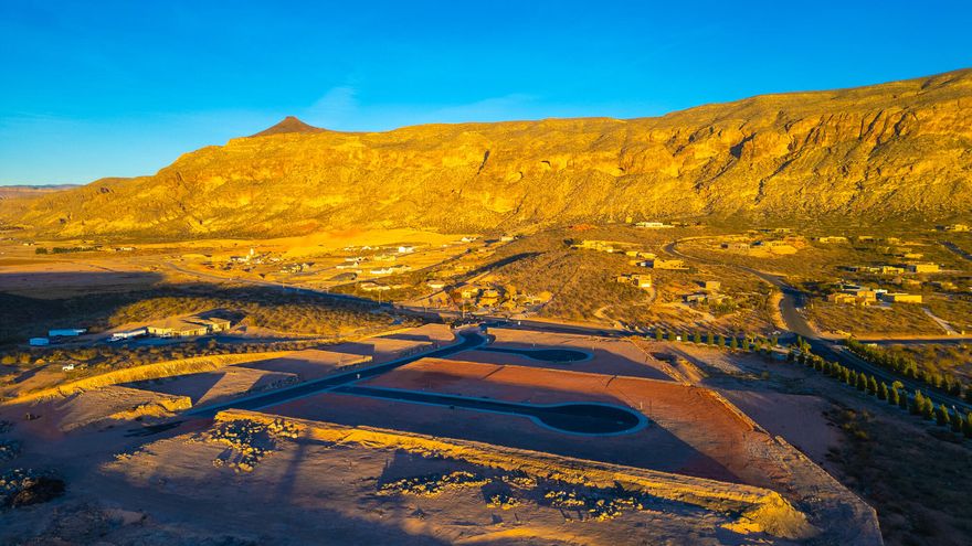Discover The Views at Hurricane Cliffs — where modern living meets iconic Southern Utah scenery. These premium oversized lots offer sweeping views of red rock cliffs, desert mesas, and expansive skies. Set within a quiet, elevated community with direct access to world-class hiking, biking, golfing, and off-roading, yet just minutes from shopping, dining, and everyday conveniences, this location offers the ideal balance of adventure and comfort. Each homesite is thoughtfully positioned to maximize privacy, views, and natural light, providing the perfect foundation to design and build a custom dream home. Buyers may work with an exclusive group of approved builders recognized for exceptional craftsmanship, custom design, and streamlined building processes. These experienced local builders are dedicated to creating homes that blend effortlessly with the landscape while capturing your personal style and vision. The Views at Hurricane Cliffs offers a rare chance to build in one of Southern Utah's most breathtaking and fast-growing areas. Come walk the lots, take in the scenery, and imagine your future home in this unforgettable setting.