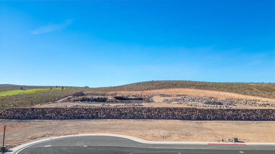 Discover The Views at Hurricane Cliffs — where modern living meets iconic Southern Utah scenery. These premium oversized lots offer sweeping views of red rock cliffs, desert mesas, and expansive skies. Set within a quiet, elevated community with direct access to world-class hiking, biking, golfing, and off-roading, yet just minutes from shopping, dining, and everyday conveniences, this location offers the ideal balance of adventure and comfort. Each homesite is thoughtfully positioned to maximize privacy, views, and natural light, providing the perfect foundation to design and build a custom dream home. Buyers may work with an exclusive group of approved builders recognized for exceptional craftsmanship, custom design, and streamlined building processes. These experienced local builders are dedicated to creating homes that blend effortlessly with the landscape while capturing your personal style and vision. The Views at Hurricane Cliffs offers a rare chance to build in one of Southern Utah's most breathtaking and fast-growing areas. Come walk the lots, take in the scenery, and imagine your future home in this unforgettable setting.