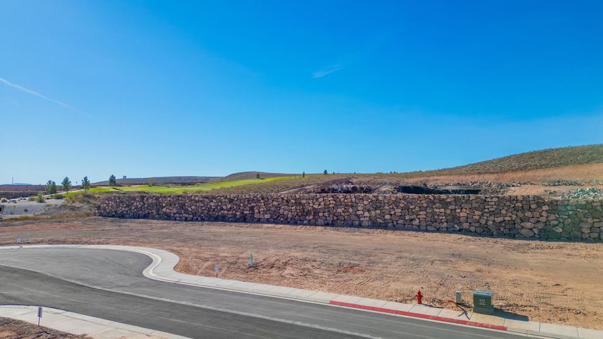Discover The Views at Hurricane Cliffs — where modern living meets iconic Southern Utah scenery. These premium oversized lots offer sweeping views of red rock cliffs, desert mesas, and expansive skies. Set within a quiet, elevated community with direct access to world-class hiking, biking, golfing, and off-roading, yet just minutes from shopping, dining, and everyday conveniences, this location offers the ideal balance of adventure and comfort. Each homesite is thoughtfully positioned to maximize privacy, views, and natural light, providing the perfect foundation to design and build a custom dream home. Buyers may work with an exclusive group of approved builders recognized for exceptional craftsmanship, custom design, and streamlined building processes. These experienced local builders are dedicated to creating homes that blend effortlessly with the landscape while capturing your personal style and vision. The Views at Hurricane Cliffs offers a rare chance to build in one of Southern Utah's most breathtaking and fast-growing areas. Come walk the lots, take in the scenery, and imagine your future home in this unforgettable setting.