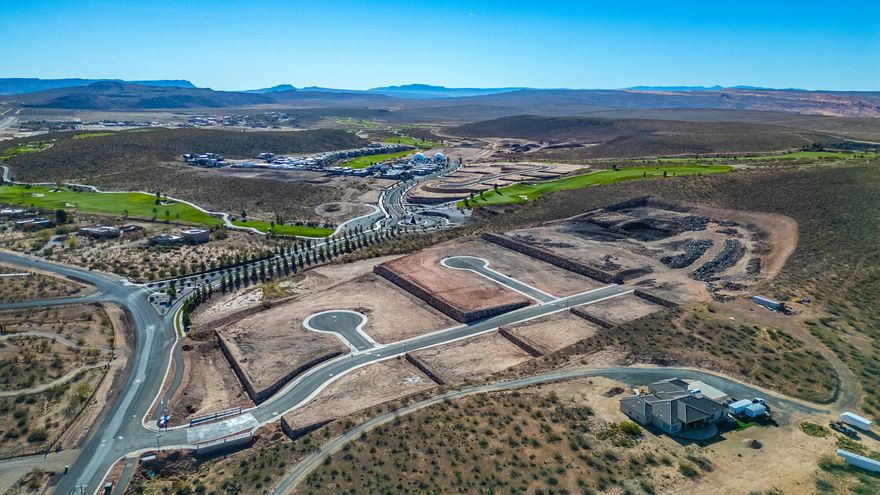 Discover The Views at Hurricane Cliffs — where modern living meets iconic Southern Utah scenery. These premium, oversized lots showcase sweeping panoramas of red rock cliffs, desert mesas, and wide-open skies. Tucked into a quiet elevated setting with direct access to world-class hiking, biking, golfing, and off-roading, yet only minutes from shopping, dining, and everyday conveniences — this community delivers the best of both adventure and comfort. Each homesite is strategically positioned to maximize privacy, views, and natural light, creating the perfect foundation to design and build your dream home. Buyers have the opportunity to work with an exclusive group of approved builders known for exceptional craftsmanship, custom design, and seamless build processes. These experienced local builders are dedicated to creating homes that blend effortlessly with the landscape while capturing your personal style and vision. The Views at Hurricane Cliffs offers a rare chance to build in one of Southern Utah's most breathtaking and fast-growing areas. Come walk the lots, take in the scenery, and imagine your future home in this unforgettable setting.