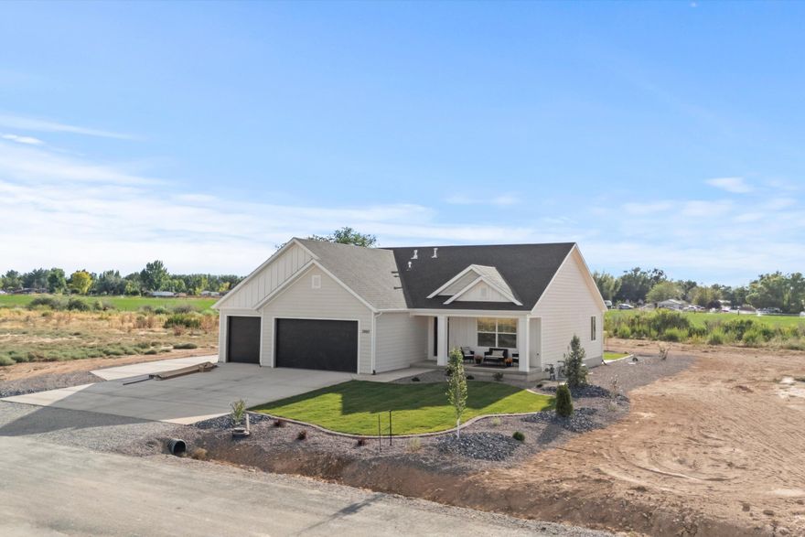 Create your perfect homestead on just over an acre with this 7-bedroom home, featuring a split-living layout and private basement entrance—ideal for multigenerational living or rental income. The large lot offers endless possibilities for gardening, outdoor activities, and room for pets and horses to roam. Vaulted ceilings, open floor plan, LVP flooring, epoxy garage, and a versatile office/bedroom with double doors provide modern comfort. Bathrooms feature tile surrounds, plus a cold storage room. Ranch-style exterior with a front porch, no HOA, six additional lots to customize, and an optional furniture package complete the package.