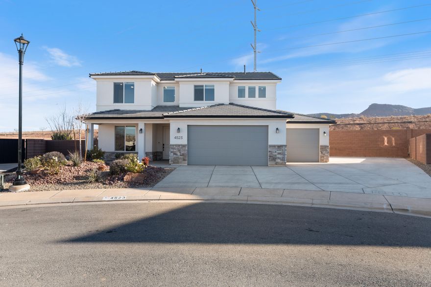 Built in 2023, this 4-bedroom, 2.5-bath home sits on a flat, usable lot with no backyard neighbors—and it still feels brand new. With 2,553 sq. ft. of well-planned space, there's room for everything: a dedicated office/den on the main level, a large loft upstairs, and an open layout that makes daily living feel easy. The kitchen features modern finishes, plenty of storage, a brand-new refrigerator, and a layout that works—whether you're cooking for the crew or chatting over snacks at the island. The family room centers around a gas fireplace and flows seamlessly into the covered patio and fully landscaped backyard. Upstairs, the primary suite includes a roomy walk-in closet and a private bath with both a separate tub and shower. Brand-new washer and dryer are included, making move-in... refreshingly simple. Tucked in a great neighborhood with access to a community pool and front yard maintenance (yes, please!), this home also offers mountain views, RV parking, and a 3-car garage. Located in the Dixie Power service area for added savings and close to top-rated schools, this one's a smart pick in Washington Fields.