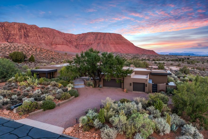 Completely gutted by current Owner, reimagined and rebuilt from the inside out, every surface, angle, window and view of this exquisite home has been crafted to present the very best of desert living. Carefully curated to elegantly blend clean contemporary lines with the natural surroundings of Kayenta, this exceptional home truly is a work of art. And once across the threshold, a work of art you'll want to call your own. 3 Beds / 3 Baths / 3 car garage / Solar Array, Battery Storage + Backup Generator = HUGE power savings! Every room flows with ease creating sanctuary in each space. Photos & video capture only a glimpse... Call Now to experience this masterpiece in person... then book the moving company so you can call it home! Some images included in this listing have been virtually staged to provide a visual example of a room's alternate use.
 
Originally built in 2000, the home was taken down to the studs and fully remodeled between 2017 - 2019, including a new roof, insulation, sheetrock, windows, doors, etc, and all new landscaping. In 2023 an additional 250 sq ft was added to the bedroom off the kitchen.
 
The home has 64 Solar Panels (310 Watt Heliena Panels) which is a 19.8- kW system. These panels carry a 25 year warranty. The Enphase Battery Wall is a 40-kW system that will run the entire home for 12-24 hours. All electricity for the home is drawn from the Battery Wall, which is continually charged by the Solar Panels. Additional power is only drawn from the power grid in the rare event of insufficient sun to charge batteries. The home additionally has a Generac Generator (powered by natural gas) should the Battery Wall and power grid simultaneously be inoperative (which has never happened since Seller has owned the home). The average token payment to Rocky Mountain Power is usually less than $20 per month.
 
The home features a cutting-edge security system.

Convenient to the Kayenta Art Village, yet a perfect distance to maintain the kind of ideal peace and privacy cherished in Kayenta. The Art Village features a variety of galleries, two superb restaurants, and the Center for the Arts at Kayenta; a professional theatre, dance, and music performance venue. The Kayenta Art Village also is home to an annual street painting festival, as well as other arts festivals throughout the year. 
 
Southern Utah is the home to several spectacular National Parks (Zion, Bryce Canyon, Arches, Capitol Reef and Canyonlands), and myriad State Parks, one of which, Snow Canyon, is literally on the other side of the mountain from Kayenta! Whether you're an outdoor enthusiast, or simply want to sit back and take in the splendor of the area, there's seriously no better place to live than Kayenta!