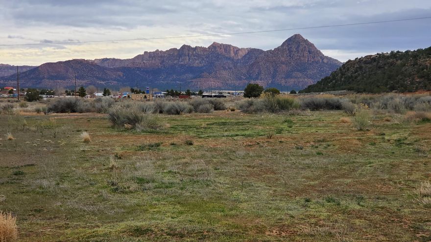 19.45 mostly flat acres with Amazing Zion views & endless potential. Located just off the highway near the gas station, this parcel boasts nearly a third of a mile of frontage—making it ideal for commercial development, residential subdivision, or equestrian use (previously used as a horse center)or Build your dream home on the south end by the other homes. Save the rest for later.
3 city wells + 3 water shares
Power on-site
Easy access year-round
Just 12 miles to Hurricane, 30 miles to Zion & St. George, and 149 miles to Las Vegas
Rumors of direct road to Zion coming.
Million-dollar homes and major developments are going in all around it—now's the time to stake your claim. Visit applevalleyut.gov for planning and zoning details.
Buyer to verify all information