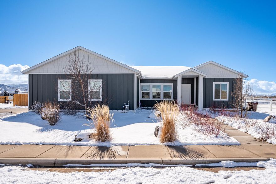 Built in 2021, this 6 bedroom, 4 bathroom home offers 2 complete living spaces with flexibility and income potential. The upper level features 3 bedrooms and 2 baths, while the fully finished basement includes a separate 3 bedroom, 2 bath apartment with its own exterior entrance and interior access to the utility room. Both levels offer full kitchens, dining areas, and separate laundry, with washers and dryers included. The extra-deep garage accommodates full-size trucks. Fully landscaped and fenced with a storage shed and additional gravel parking for convenience.