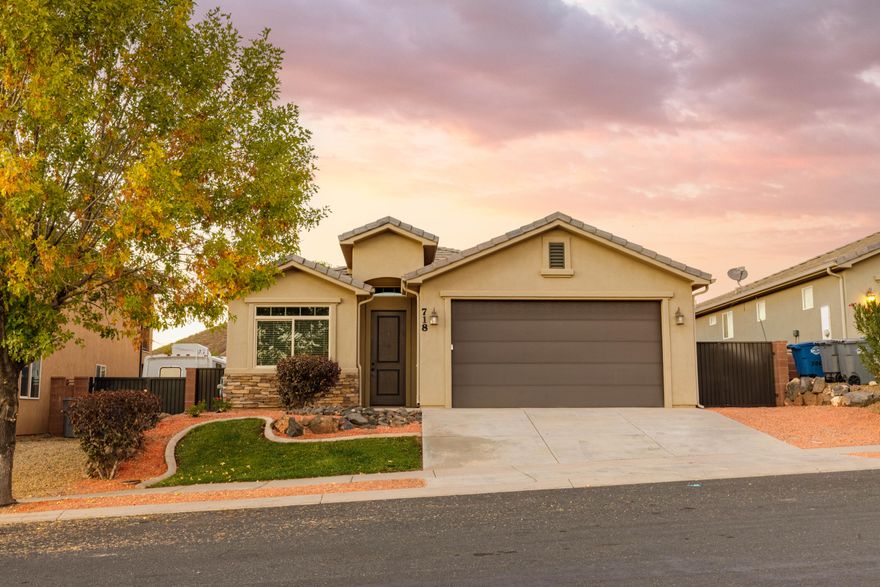 Cute rambler in the well-maintained Ivy Wood subdivision. New carpet throughout the home. Open layout with a spacious kitchen featuring a breakfast bar, center island, granite countertops, fridge, and ample storage. The spacious living room offers built-in shelving and multiple closets. Valley Academy and Hurricane Elementary are just around the corner, with easy access to State Route 9 and shopping in downtown Hurricane. Refreshed backyard with new sod, plants, block walls on all 3 sides and iron gate. Enjoy scenic neighborhood views of the city and mountains from your front door.
