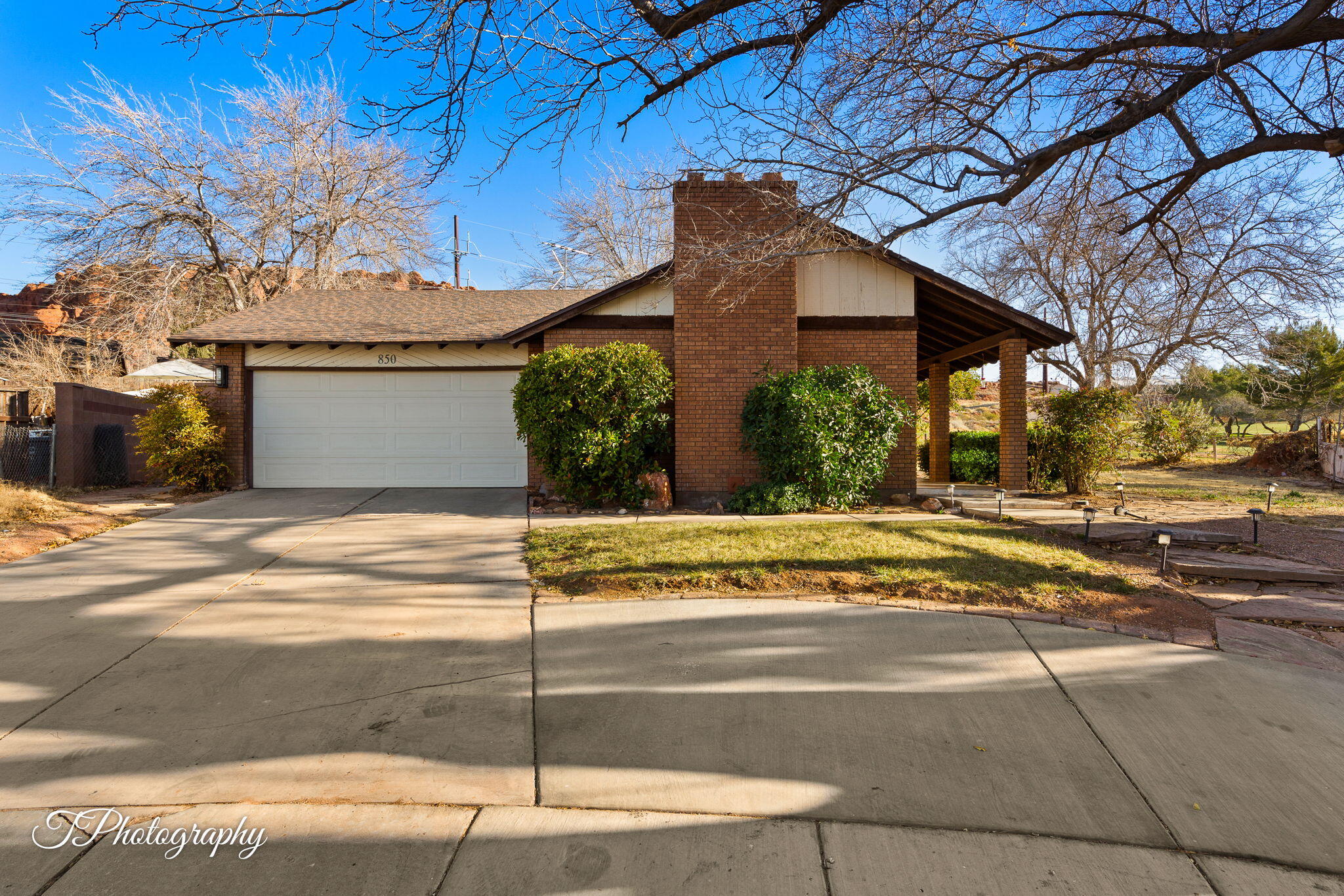 Nestled at the end of a peaceful cul-de-sac and backing up to the scenic Red Hills Golf Course, this charming 3-bedroom, 2-bathroom home offers a rare combination of privacy, space, and breathtaking views of lush greens and stunning red rock landscapes.
Step inside to discover an inviting open-concept living area, complete with vaulted ceilings, custom built-in shelving, and a cozy fireplace, perfect for gatherings. The bright and airy kitchen features modern appliances, ample counter space, and beautiful cabinetry, making meal prep a breeze.
Each bedroom boasts natural light and spacious closets, while the primary suite features a stylish accent wall and an en-suite vanity space. The bathrooms are fresh and bright, offering timeless tilework and plenty of storage. Outside, enjoy a backyard with rustic stone landscaping, a covered patio, and direct access to the golf course, where you can take in stunning desert sunsets and peaceful mornings. The home also includes a two-car garage and ample driveway parking, mature trees, and a beautifully landscaped front yard. Conveniently located near hiking trails, parks, and shopping, this home provides both tranquility and easy access to everyday conveniences.
Whether you're a golf enthusiast, nature lover, or just looking for a peaceful retreat, this home is a must-see!