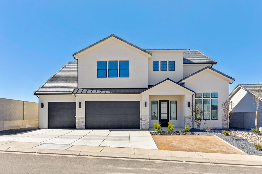 MAJOR PRICE IMPROVEMENT! Welcome to the Summitglow, an impressive 3,634 sq ft home designed to elevate everyday living. Featuring 6 bedrooms, 3.5 bathrooms, and 3-car garage, this home offers room to grow with refined style throughout. Enjoy soaring 10' ceilings on the main level and 9' ceilings upstairs, complemented by 8' tall doors that enhance the home's grand, open feel. A front office provides the perfect workspace, while the oversized upstairs loft offers endless flexibility for a media room, play space, or second living area.
The heart of the home shines with elevated finishes, including generous kitchen cabinetry, a tiled backsplash, 3cm quartz countertops, a built-in hood, and upgraded appliances—fridge included. The spa-like primary suite is a true retreat, highlighted by a stunning freestanding tub and upscale finishes. Additional upgrades include a modern black railing, built-in mudroom bench, laundry room cabinetry, upgraded carpet and pad, and a large covered back patio ideal for outdoor entertaining. Thoughtfully designed and beautifully finished, the Summitglow delivers luxury, comfort, and functionality in one exceptional home.