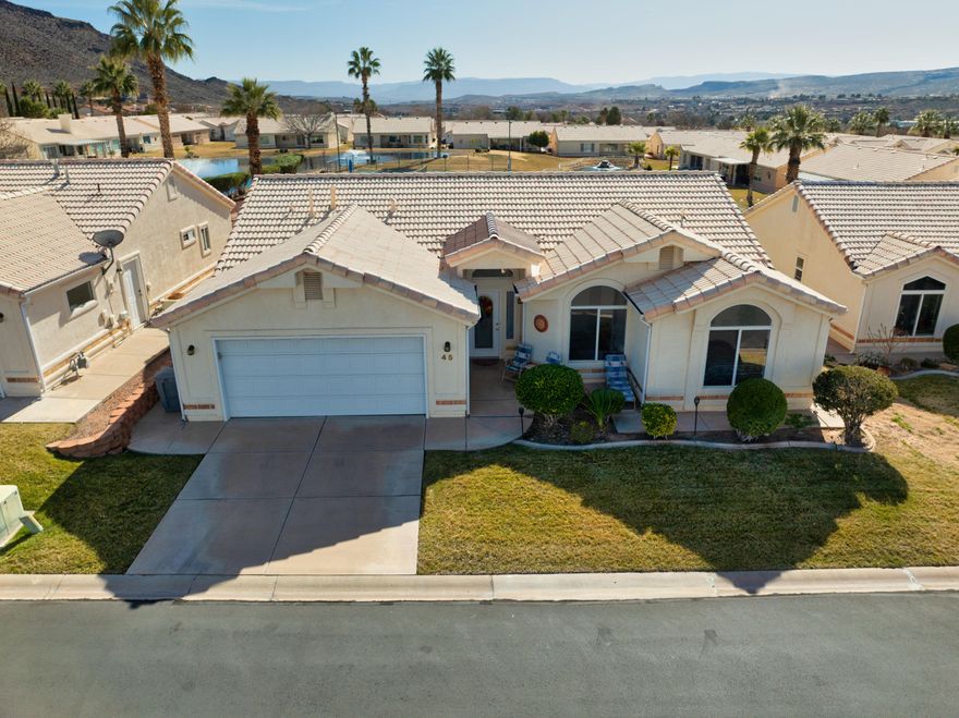 Welcome to this inviting 55+ home offering beautiful views and unforgettable sunsets in a peaceful, comfortable setting. Designed for easy living, the home has a warm, homey feel and is perfectly located just minutes from downtown St. George. Within the last year, the home has been refreshed with all new appliances, a tile roof, new carpet and tile flooring, a new furnace, and marble surrounds in the bathroom. The HOA provides a variety of amenities including an indoor pool, clubhouse, gym, and pickleball courts, creating opportunities to stay active and connected year-round. Enjoy quiet moments at home, take in the views, or head into town for shopping, dining, and entertainment-this home offers the best of relaxed, low-maintenance living.