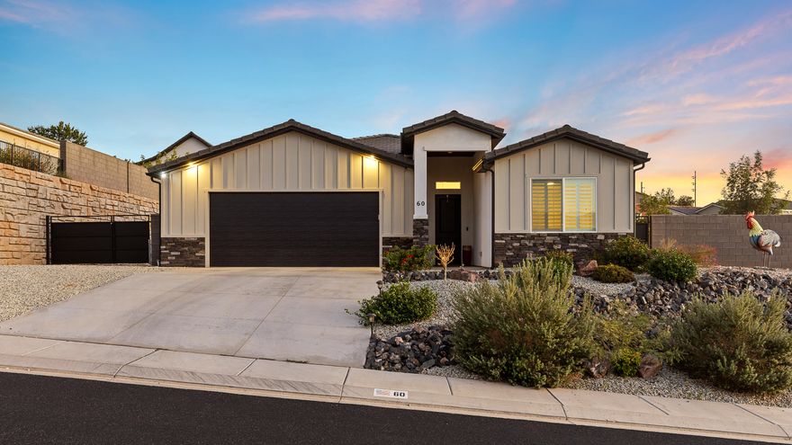 This corner-lot home blends space, privacy, and stunning views. From the backyard, enjoy unobstructed Pine Valley Mountain scenery. The yard is designed for living- mature landscaping, a gorgeous privacy wall, gated RV parking with water and sewer hookups, and even room for a pool! Inside, raised ceilings in the entry, living space, & primary bedroom, an open split floor plan, and oversized bedrooms create a bright, inviting feel. The kitchen boasts a large pantry with outlets for appliances and a motion-sensor light, while the garage features epoxy floors and a water softener. Enjoy high quality features like soft close drawers & cabinets, 8' doors, thoughtful storage, quartz countertops, & more! 
Low-maintenance front landscaping adds convenience, and the best part- there's no HOA!