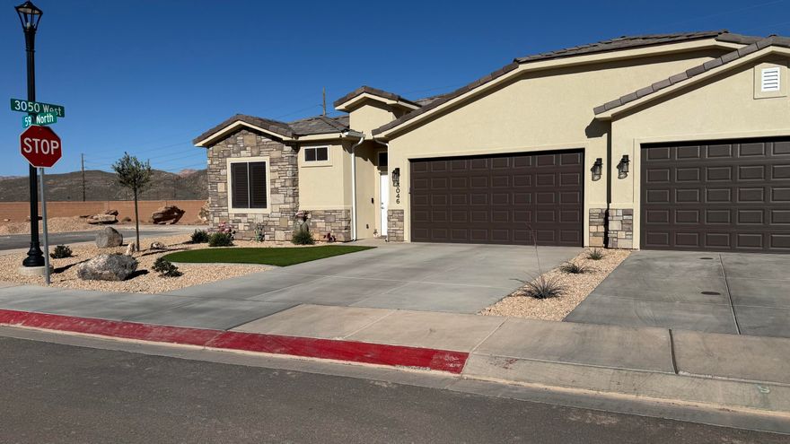 This nearly new home is move-in ready! One of the few single story townhomes in the area, this home has many high-end features including porcelain wood-grain tile floors, 10' ceilings, fully tiled walk-in shower with a glass enclosure, stained hardwood cabinets with soft close hinges and under cabinet lighting, quartz counter tops throughout, two-toned paint  for extra style, fully finished garage, covered patio, block wall and fully landscaped backyard with turf, top notch plumbing fixtures, home has aesthetically pleasing synthetic energy efficient stucco and stone exterior with super-durable concrete-tile roof! Plus RV parking! . HOME BEING SOLD TURN KEY, WITH THE EXCEPTION OF THE WALL ART