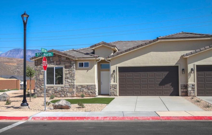 This nearly new home is move-in ready! One of the few single story townhomes in the area, this home has many high-end features including porcelain wood-grain tile floors, 10' ceilings, fully tiled walk-in shower with a glass enclosure, stained hardwood cabinets with soft close hinges and under cabinet lighting, quartz counter tops throughout, two-toned paint  for extra style, fully finished garage, covered patio, block wall and fully landscaped backyard with turf, top notch plumbing fixtures, home has aesthetically pleasing synthetic energy efficient stucco and stone exterior with super-durable concrete-tile roof! Plus RV parking! . HOME BEING SOLD TURN KEY, WITH THE EXCEPTION OF THE WALL ART