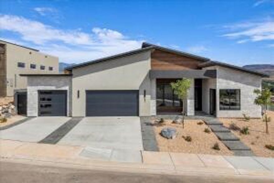 Welcome to your dream home just 35 minutes from Zion and 20 minutes to Sand Hollow! This brand-new build showcases stunning upgrades including expansive picture windows, a kitchen hutch, upper cabinets, and modern lighting. Enjoy breathtaking sunrises from the open kitchen, dining, and great room with views of the Virgin River bridge and surrounding mountains. A full casita with its own kitchen and washer/dryer offers privacy for guests or long-term stays. Double sliding doors lead to a spacious covered patio, and with the backyard pre-plumbed for a pool, you can create the perfect oasis to match the view.