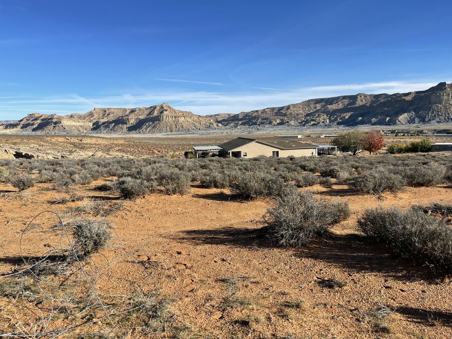 Large Single Family Building Lot in an elevated location at the top of the Subdivision.  located on the West side of Highway 89, this newer location is ideal considering  long term value and unobstructed views.  Lot has a gentle slope with all utilities to the lot line, including a water connection.  Spacious 1.39 acre lot adjoins the State Trust Lands on the West providing a natural and serene backdrop with access to surrounding outdoor adventure, right from your own front door.  
** Sellers designed a SW Style home for this lot that is complimentary to this pristine Desert environment.   Plans feature an inspiring 2400 Sq. Ft. home, 3 car garage plus 30' x 50' RV garage.   
** Financing is available.
This is an exceptional building lot within minutes to Lake Powell.