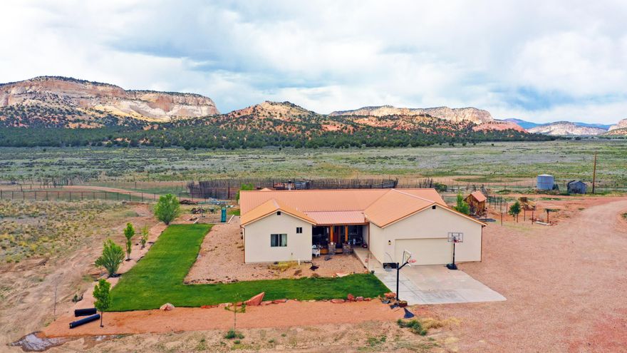 Nestled at the mouth of breathtaking Johnson Canyon, this 4-bedroom, 3-bathroom ranch-style retreat offers the perfect fusion of serenity, functionality, and unparalleled access to Southern Utah's natural beauty. Sitting on 10 fully usable acres that back directly onto protected BLM land, you'll enjoy uninterrupted views of towering red cliffs and endless open skies-your private slice of the American West. Nestled at the mouth of breathtaking Johnson Canyon, this 4-bedroom, 3-bathroom ranch-style retreat offers the perfect fusion of serenity, functionality, and unparalleled access to Southern Utah's natural beauty. Sitting on 10 fully usable acres that back directly onto protected BLM land, you'll enjoy uninterrupted views of towering red cliffs and endless open skies-your private slice of the American West. Designed for those who crave space and versatility, the property includes a charming main residence with warm natural light, an open floor plan, and sweeping canyon views; a well-equipped horse barn; a massive detached workshop perfect for storage, hobbies, or business operations; and an income-generating ADU (accessory dwelling unit) ideal for guests, rental income, or multi-generational living. Whether you're starting your dream homestead, launching a short-term rental business, or simply escaping the hustle, this property checks every box. Located just minutes from downtown Kanab, you're in the epicenter of outdoor adventure, with Zion National Park 30 minutes away, Bryce Canyon under an hour, Lake Powell just over an hour, and the Grand Canyon North Rim a mere 90 minutes. Surrounded by world-class hiking, slot canyons, and wildlife refuges, Johnson Canyon offers the peace of remote living with the convenience of being within reach of Kanab's restaurants, shops, and services. Few properties offer this level of freedom, potential, and natural beauty in one package.