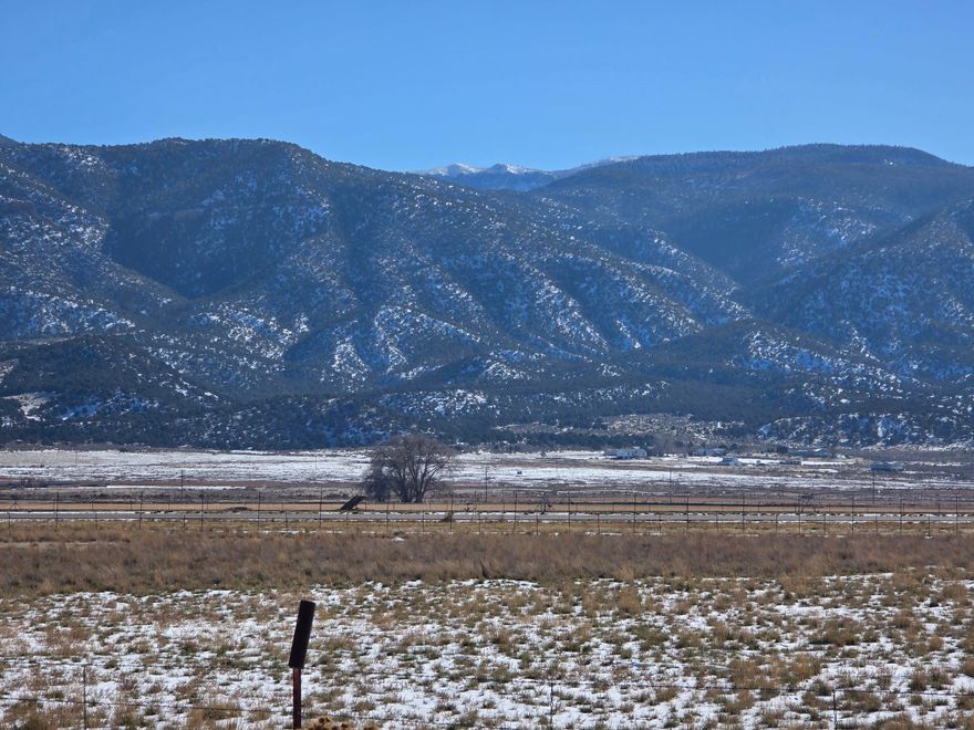 Prime 9.77-Acre Property with Gorgeous Mountain Views - Perfect for Your Dream Home or Mini Ranch!

This expansive 9.77-acre parcel offers the perfect blend of privacy and convenience, featuring stunning panoramic mountain views that will take your breath away. The property is fully fenced, making it ideal for those looking to create a mini ranch or private estate.

Key features include:

* **Newly Drilled Well** - Ready for your water needs, with **4-acre feet of water rights** included.
* **Paved Road Access** - Easy, year-round access to your land.
* **Power Available** making it simple to build your dream home or any structures you desire.
* **Spectacular Mountain and Farmland views!