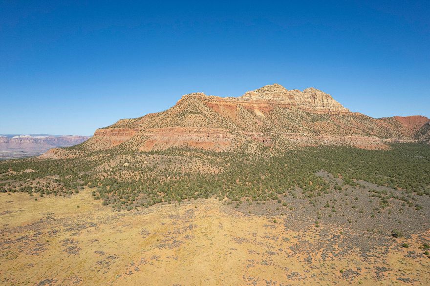 DAYBREAK MESA DRIVE AREA OF APPLE VALLEY - NEWLY ENTITLED DEVELOPMENT PARCEL - PERFECT FOR THE DEVELOPER / BUILDER CLIENT Consisting 61.78 Acres. Includes Conceptual Plan of 11 Separate 5 + Acre New Ranch and Home Parcels, ranging in size from 5.00 Acres to 5.37 Acres each. Includes Copy of Land Survey, Soils Report, Environmental Report, and has received Apple Valley Town Council Approval for Zone Change to A-X Agricultural Zone and 18.534 Acre Feet of Water per Water Right Number: 81-4536. Parcels adjoin and are between the highly popular new subdivision of Day Break Mesa Homes and Main Street in Apple Valley. A Prime Future Development Parcel for Builders and Master Plan Developers seeking New Parcel, New Community Inventory overlooking and near by the popular Gooseberry Mesa... mountain biking trails and Zions View shed areas of Apple Valley.