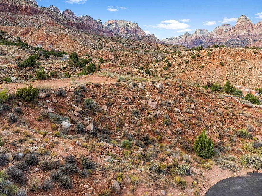 Nestled at the very top of the sought-after Kinesava subdivision, this is your private Zion overlook: .81 acres of breathtaking, 360-degree peace. Enjoy the serenity of this quiet cul-de-sac location, just minutes from the entrance to the park. Experience nature at your doorstep with world-class hiking, biking, and outdoor adventures nearby, while being conveniently close to shopping, dining, art galleries, and more. This is a rare opportunity to build your dream home on a prime piece of land with unparalleled natural beauty and proximity to Zion National Park.