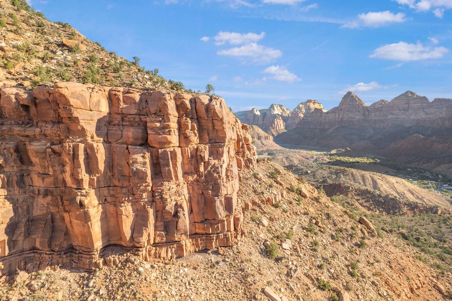 Nestled at the very top of the sought-after Kinesava subdivision, this .81-acre lot offers breathtaking 360-degree panoramic views of Zion National Park. Enjoy the peace and serenity of this quiet cul-de-sac location, just minutes from the entrance to the park. Experience nature at your doorstep with world-class hiking, biking, and outdoor adventures nearby, while being conveniently close to shopping, dining, art galleries, and more. This is a rare opportunity to build your dream home on a prime piece of land with unparalleled natural beauty and proximity to Zion National Park.
