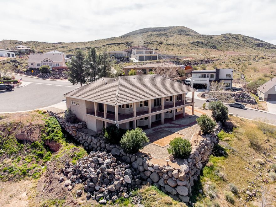 This home features 5 bedrooms, 3 bathrooms, and a 3-car garage across 3,780 sq ft. Elevated above Hurricane Valley, it offers incredible views of Pine Valley, Zion, Sky Mountain, and Cedar Mountain, framed perfectly through large kitchen windows. Enjoy a 1,000 sq ft wrap-around deck with unbeatable sunrise-to-sunset view the walk-out basement includes 2 bedrooms, a full bath, kitchenette, and a large family room. Ideal for a theater, gaming, or entertaining. There's also a safe room and a backyard ready for your vision--think pool or outdoor living space. Built in 1997, the home has been updated with a remodeled master bath, new carpet, refreshed front porch, and newer windows. Additional perks include a new water heater and a garage air compressor with pneumatic lines to the deck and hobby room.