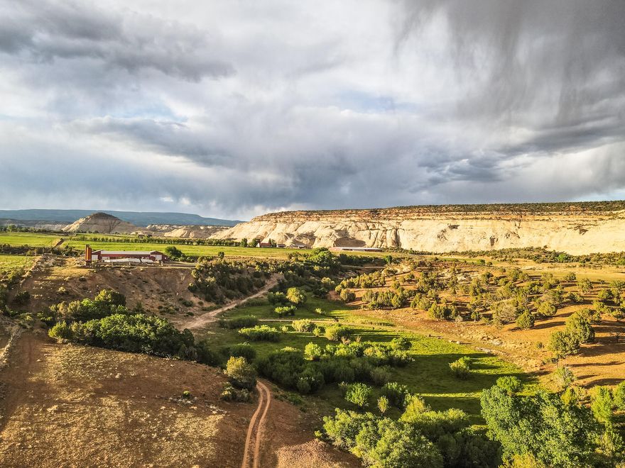 Incredible 144+ acres situated at the south end of Boulder, UT with stunning views in every direction! Several ideal building sites for your future home, with a Well & septic in place. Bordered by Grand Staircase Escalante Nat'l Monument on the South and East, with a seasonal creek running through the property. Bring the horses, cattle or both with plenty of irrigation and a T&L brand Pivot. Includes 30''A'' Shares and 30 ''C'' Shares of Boulder Irrigation. Then there are the shops... Huge 3600 SF Mechanic/ Auto shop with 2 oversize doors that accommodates large equipment and vehicles. Well built with concrete floors, power & overhead lighting, a heated office with bathroom, plus a separate area with workbenches & cabinets. Bring the toys, RV, horses, they'll all fit!