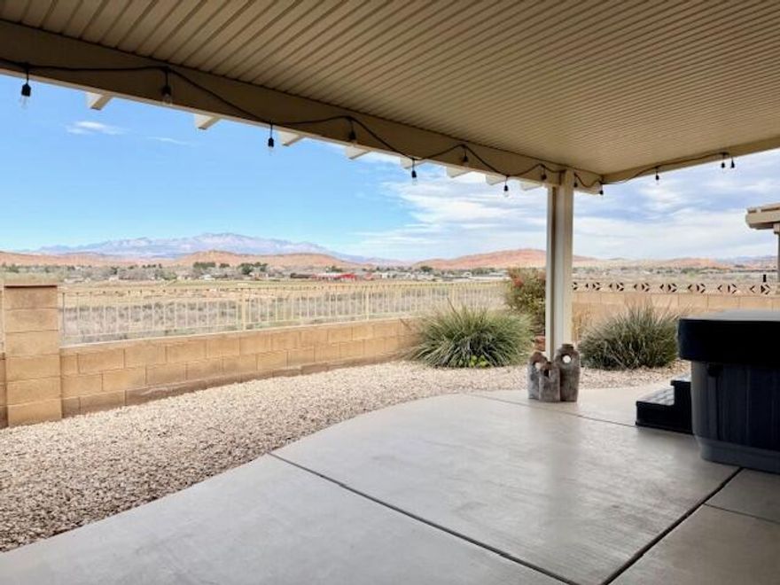 Unobstructed views in the SunRiver 55+ community capture sweeping vistas of the Virgin River, Pine Valley Mountain, and surrounding bluffs, mesas & plateaus. This well-cared-for home features desirable upgrades, including a stone surround gas fireplace with hearth and mantel, built-ins, tile flooring, ceiling fans, and window coverings. Enjoy year-round indoor-outdoor living with a front patio, two rear patios (one covered, one uncovered), a sunroom just off the living and dining areas, and a hot tub perfectly positioned to take in the views. Furnishings are negotiable. Home has reverse osmosis, solar tube, new HVAC & outdoor hot tub (installed in 2025), water heater & stove (replaced in 2024). Convenient access to biking, walking, and hiking trails enhances the outdoor lifestyle. In addition to this private retreat, residents enjoy access to a 35,000 sq ft community center, activities, pools, a golf course, and an on-site restaurant. Welcome home!