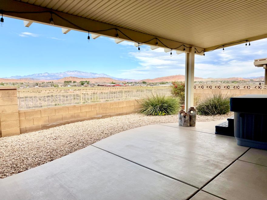 Unobstructed views in the SunRiver 55+ community capture sweeping vistas of the Virgin River, Pine Valley Mountain, and surrounding bluffs, mesas & plateaus. This well-cared-for home features desirable upgrades, including a stone surround gas fireplace with hearth and mantel, built-ins, tile flooring, ceiling fans, and window coverings. Enjoy year-round indoor-outdoor living with a front patio, two rear patios (one covered, one uncovered), a sunroom just off the living and dining areas, and a hot tub perfectly positioned to take in the views. Furnishings are negotiable. Home has reverse osmosis, solar tube, new HVAC & outdoor hot tub (installed in 2025), water heater & stove (replaced in 2024). Convenient access to biking, walking, and hiking trails enhances the outdoor lifestyle. In addition to this private retreat, residents enjoy access to a 35,000 sq ft community center, activities, pools, a golf course, and an on-site restaurant. Welcome home!