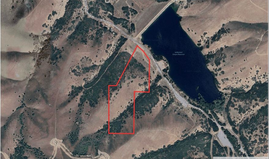 Don't miss this rare opportunity to own two vacant lots sold together, totaling 20 acres on the south end of Tooele and directly across from Settlement Canyon Reservoir--providing immediate access to hiking, fishing, and year-round outdoor recreation. The property features uphill topography that captures sweeping views of the surrounding landscape, offering a dramatic backdrop for whatever you envision. Set in a peaceful, scenic location yet just minutes from Main Street, it delivers both seclusion and convenience. A truly unique offering with outstanding potential.