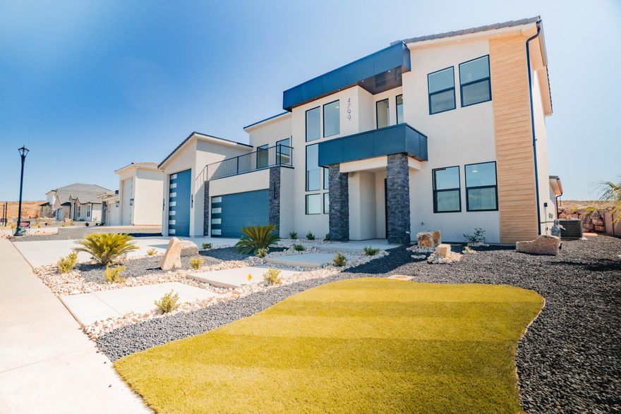 ~Full Custom Home Near Sand Hollow~This stunning Big Rock Homes home in the sought-after Sand Hollow Village area blends modern comfort with the ultimate recreational lifestyle. This home has a massive 52-FOOT DEEP RV GARAGE (12' wide x 14' tall door)! Inside, you'll find an open-concept layout with LUXURY FINISHES, spacious bedrooms, and LARGE BACKYARD WITH ROOM TO ADD A POOL! This property comes equipped with premium SMART HOME features including 3 wired in insecurity cameras and a door bell camera. Just minutes from Sand Hollow Reservoir, Sand Hollow Golf Course, the sand dunes, and Zion National Park, you're surrounded by year-round adventure — boating, biking, hiking, off-roading, and more. Contact listing agent for PRIVATE SHOWINGS.