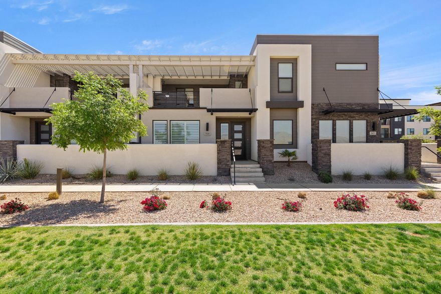Experience resort-style living in the highly sought-after Desert Color community! This beautifully designed townhouse is approved for short-term rentals and offers the perfect blend of comfort, style, and investment potential. The light and bright interior features an open-concept layout with modern finishes and inviting living spaces throughout. Step outside to your private deck complete with a relaxing hot tub, perfect for unwinding after a day of adventure. Enjoy access to incredible community amenities including the stunning lagoon, pools, sandy beaches, pickleball courts, trails, and more. Whether you're looking for a vacation getaway, income-producing property, or both, this Desert Color retreat checks all the boxes.