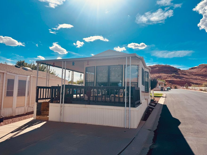 Furnished and move-in ready, this well-maintained Park Model is situated in a peaceful setting with a beautiful view of Zion and Red Mountain. Enjoy the comfort of a spacious porch with brand-new carpet—perfect for relaxing and taking in the scenery. Inside, the home is exceptionally clean and features a full-size washer and dryer, a separate office space, and a newer water heater (installed 1.5 years ago). This charming property offers both comfort and convenience in a stunning location.  Buyer to verify all information.