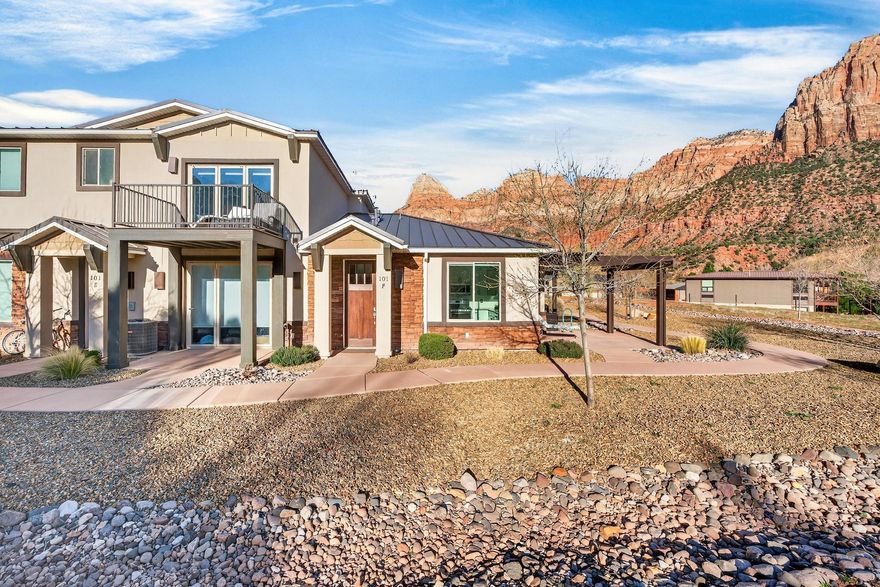 Welcome to your private Zion retreat where the rhythm of nature replaces the noise of the world. Tucked into a quiet corner of Springdale, this beautifully designed 1-bedroom, 1-bath condo offers an intimate escape beneath the towering red cliffs just moments from the entrance to Zion National Park.

Built in 2020 and thoughtfully upgraded, this 538 sq ft residence blends refined design with effortless functionality. Inside, fresh interior paint and beautifully refinished cabinetry create a warm, modern aesthetic. The living area features custom built-ins offering elegant shelving, a dedicated desk space, and abundant hidden storage perfect for maximizing comfort in this efficient layout.

The kitchen has been refreshed. Appliances include a microwave, stove/oven, refrigerator, dish washer, washer & dryer and disposal, while the home's water system has been enhanced with an advanced 11-stage drinking water filtration system by Oxygen Ozone and a water softener bringing everyday luxury to your mountain retreat.

Step outside and soak in the magic of the desert landscape. From the back porch, enjoy breathtaking, unobstructed views of The Watchman as the red rocks glow at sunrise and sunset. Wildlife often passes quietly through the neighborhood, making each day feel like a private nature documentary.

Despite the peaceful setting, you are only a half mile from the entrance to Zion National Park and just moments from the charming shops, art galleries, and restaurants in the heart of Springdale. Spend your mornings hiking iconic trails, afternoons exploring local cafés and boutiques, and evenings watching the canyon walls turn gold beneath the desert sky. Whether you are seeking a personal getaway, a low-maintenance basecamp for adventure, or a serene place to simply breathe in the beauty of southern Utah, this thoughtfully curated home delivers.

HOA includes: landscaping, exterior pest control, trash service, exterior insurance, and maintenance of common areas so you can spend more time enjoying Zion and less time worrying about upkeep.

Life here is simple, peaceful, and unforgettable exactly how living near Zion should feel.