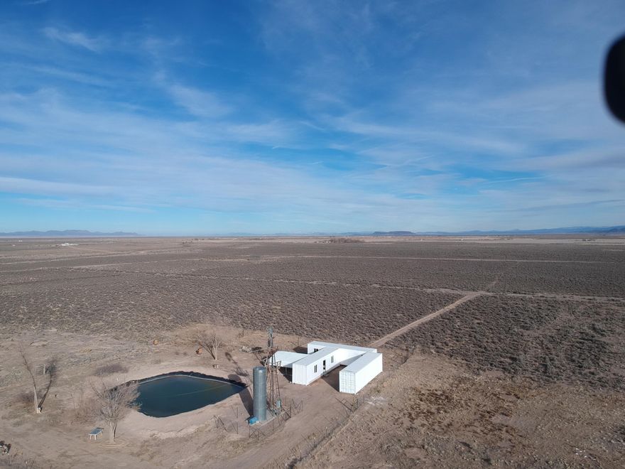 10 Acres of land with 2 ACFT of water rights included with a priority date of 1944. Property already has working well with a water storage tank. Power and a lined pond on the property. 3 custom storage containers included. Buyer to verify all information