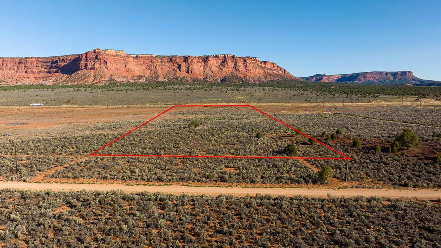 Discover 10 acres of pristine Red Rock country, surrounded by juniper and sage for privacy and sweeping views. The land borders BLM property, ensuring protected beauty and direct access to wide-open spaces. With a 1-acre foot water right included, this property offers flexibility for future improvements. Perfect for equestrian use, building a retreat, or enjoying the freedom of open land. Just a short drive to Zion, Bryce Canyon, the Grand Staircase-Escalante, and the North Rim of the Grand Canyon. Don't just visit the Southwest—live in it. (Buyer to verify all).