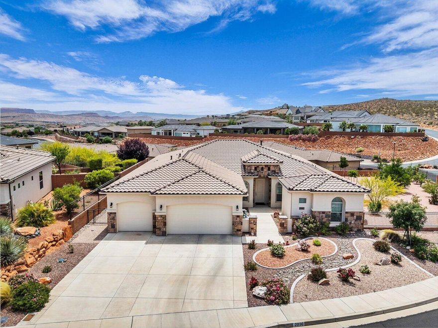 Welcome home to this beautifully maintained single-owner home situated on a spacious corner lot, offering breathtaking unobstructed mountain, desert, and sunset views from its elevated setting above neighboring homes. The inviting foyer flows seamlessly into the open great room, where a cozy gas fireplace creates the perfect atmosphere for relaxing or entertaining. Designed for both comfort and functionality, the attached casita features its own private entrance, split-type heating and cooling system, a large bedroom spacious enough for a California King bed, plus a microwave, mini-fridge, sink, and beautiful cabinetry, perfect for guests or generational living. The spacious primary suite offers a true retreat with a multi-jetted jacuzzi tub, en-suite bathroom, and an impressive walk-in closet. Sliding glass doors lead to an incredible 70-foot patio with multiple seating and entertaining spaces, perfectly positioned to capture the soothing sunsets and stunning desert scenery. The side yard is accented with mature fruit and shade trees, while the meticulously landscaped grounds provide beauty with minimal maintenance. Additional upgrades include soft-close kitchen cabinets and drawers, epoxy garage floors, ceiling-mounted storage racks, an EV charger, and the convenience of easy single-level living throughout. Buyer to verify all information, deemed reliable, however buyer to verify all info including utilities, rental restrictions, and HOA information if applicable.