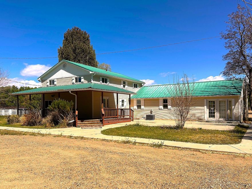 Exceptional Investment Property in Scenic Escalante, Utah. Set against the breathtaking backdrop of southern Utah's red rock country, this rare 1.44 acre multi use property in the heart of Escalante offers an extraordinary opportunity for investors, entrepreneurs, and anyone seeking a versatile space with room to grow. With a combination of a two story home--previously used as an office--and a substantial metal warehouse equipped with a shipping door and truck ramp, this property is uniquely positioned to support a wide range of commercial, residential, or mixed use visions. Whether you're dreaming of a business hub, a vacation rental, a live work setup, or a storage and logistics operation, the possibilities here are as expansive as the surrounding landscape.