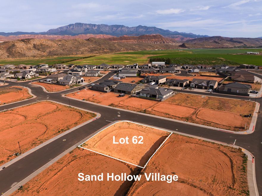 A short RZR ride from Sand Hollow Reservoir and the sand dunes, adventure starts at your garage door. Build your home base for adventure in Phase 2 of Sand Hollow Village. This lot was made for people with toys--ideal for a modest home with a massive RV garage. Keep your camper, boat, side-by-side, Jeep, and motorcycles...all the gear...on site and skip the storage unit. A place to launch big weekends, unwind after long days outside, and settle in for the long haul--whether you're growing a family or easing into retirement. Friendly, clean neighborhood with sensible CC&Rs that protect quiet enjoyment. No snooty HOA. All builders welcome. Call for an introduction to a home builder. We've been waiting for you.