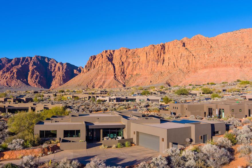 864 embodies the uncomplicated, relaxed, and understated sophistication that upscale contemporary southwestern design offers, in a community of unsurpassed beauty. This is luxurious living that provides everything needed for a life well lived.
Experience the extraordinary enchantment of Kayenta. Environmentally sensitive, culturally vibrant, and with an uncompromising commitment to modern desert living.   
Endless recreational opportunities await. Explore, discover, and cherish this incomparable land.
This home features: Solar, gas-powered generator, oversized 3-car garage (2-car tandem) with a generous heated/cooled storage room/workshiop and custom cabinetry, central vacuum, heated floors in kitchen and bath, dual shower, two water features, drip irrigation, and three patios. Set against the awe-inspiring backdrop of Kayenta's iconic red rock cliffs,adorned with cascading waterfalls after a desert rain.864 overlooks the vast 6,000-acre Santa Clara River Reserve. Here, every moment invites connection with the land: whether stargazing under crystal-clear night skies or soaking in the endless "blue view" stretching toward Utah's West Mountain, Arizona's Beaver Dam Wash National Conservation Area, and the nearby Joshua Tree National Natural Landmark.
At 864, nature, culture, and serenity converge, offering a lifestyle unlike any other.
Owners are Kayenta Recreation Association (KRA) members.