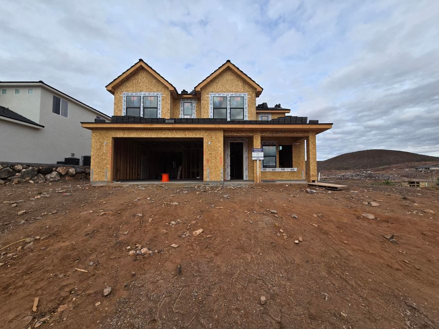 Discover your dream home at Fire Rock, a stunning new D.R Horton community in Hurricane, UT! Explore the ''Slickrock'' floorplan featuring boosting upgrades and the best part? NO HOA. This inviting two-story home sits on a corner lot and offers a spacious 5 bedrooms, an office, 3.5 bathrooms, and a 2-car garage with an added toy garage. Perfect space for a growing family and plenty of room for toys. Estimated completion February 2026. Ask me about our generous home warranty & special financing when using our in-house lender DHI Mortgage. Improving quality of life here with its prime location, Fire Rock is truly a gem. Don't miss out on the opportunity to make it your own.