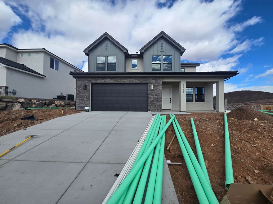 Discover your dream home at Fire Rock, a stunning new D.R Horton community in Hurricane, UT! Explore the ''Slickrock'' floorplan featuring boosting upgrades and the best part? NO HOA. This inviting two-story home sits on a corner lot and offers a spacious 5 bedrooms, an office, 3.5 bathrooms, and a 2-car garage with an added toy garage. Perfect space for a growing family and plenty of room for toys. Estimated completion February 2026. Ask me about our generous home warranty & special financing when using our in-house lender DHI Mortgage. Improving quality of life here with its prime location, Fire Rock is truly a gem. Don't miss out on the opportunity to make it your own.