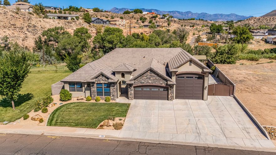 Tucked away on a peaceful street, this beautifully upgraded custom home offers both privacy and breathtaking scenery. A creek flows along the back of the property, framed by mature trees and showcasing dramatic views of the rugged lava cliffs across the canyon. Designed with both comfort and function in mind, the home features an oversized RV garage measuring 50 feet deep by 16'8'' wide with an attached workshop, plus an additional 15-foot-wide side space for extra RV parking. NO HOA

Step inside through the inviting courtyard, complete with a casita entrance, and discover an open floor plan where the kitchen, dining, and living areas form the heart of the home. The kitchen is equipped with a double oven and flows seamlessly into the living space, perfect for gatherings. The thoughtful layout places the master suite on one side for privacy, while guest rooms are positioned on the other.

Outdoors, the beautifully landscaped backyard is a private retreat, featuring iron fencing along the back, an extended patio, and a gazebo ideal for entertaining. For those seeking even more space, the adjacent lot is also availableoffering room to spread out or the chance to choose your future neighbor.

This home combines serene natural surroundings with modern upgrades and exceptional amenities, making it a truly unique place to call home.