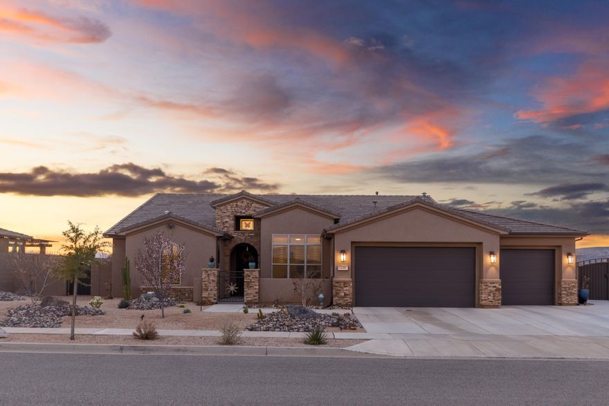 Perched on the rim in the highly sought-after Views at Coral Canyon, this exceptional home offers unobstructed panoramic views, privacy, and thoughtful upgrades throughout. The open-concept floor plan is designed for both everyday living and entertaining, featuring spacious living areas, a dedicated gym, and seamless indoor-outdoor flow. Step outside to your private backyard retreat complete with a pool, hot tub, and outdoor kitchen, perfectly positioned to take in the breathtaking scenery. Additional upgrades include electric shades, a whole-home water filtration system, and extra parking. Location is ideal with direct access to miles of scenic trail systems right from your doorstep. Located just minutes from shopping, dining, golf, and daily amenities, this meticulously maintained home offers the perfect balance of location, lifestyle, and views.