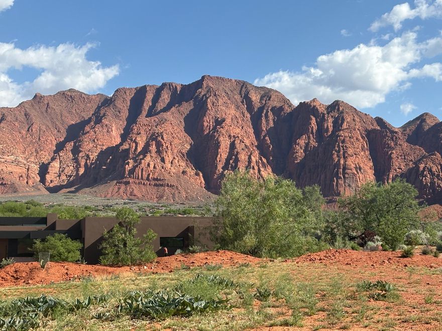 This beautiful 1.95 acre lot over looks Kayenta wash, and all the vast open area it has to offer. Many years ago, this property was used as a coral area, so it is relatively flat. Being the last remaining developer lot of this type, it is a great opportunity to build your desert oasis home in the quiet, dark skies Kayenta Community. Fabulous unobstructed Red Mountain, Beaver Dam, and wide open-nature views are in abundance. This is  just a short drive or bike ride away from the Kayenta Art Village, where you will find galleries, restaurants, art classes and live theater.