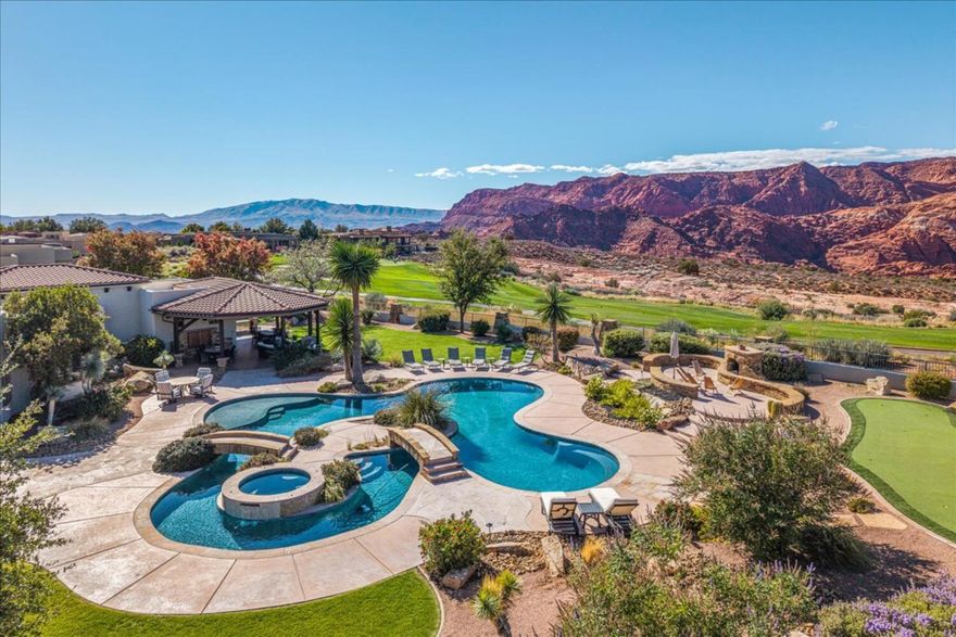 Welcome to 2110 Long Sky Dr, a private sanctuary of refined living, secured behind its own private access gates. This exceptional estate captures the beauty and grandeur of Southern Utah, offering both tranquility and sophistication. Perched on 1.2 pristine acres, it showcases breathtaking panoramic views that will make you feel like you are on top of the world. Thoughtfully designed for seamless indoor-outdoor living, this single-level home features expansive automatic sliding doors that open to a resort-style retreat complete with a lazy river pool, hot tub, oversized cabana, outdoor kitchen, and private putting green, crafted for both relaxation and entertaining. Inside, masterful craftsmanship and meticulous attention to detail define every space. Vaulted ceilings and top-of-the-line finishes create an ambiance of refined elegance. Each room is a testament to the property's stunning Snow Canyon views and vast open skies. A private casita, featuring its own garage, kitchenette, and Murphy bed, offers versatility for guests, multigenerational living, or a private retreat.

Indulge in the ultimate entertainment experience in your private theater room, complete with surround sound, a snack bar, and dimmable lighting. Additional luxuries include five fireplaces, an outdoor shower off the master suite, climate-controlled garages, full-house surround sound, and a gated courtyard with an automatic entrance.

This is more than a home. It's an unparalleled living experience in one of Utah's most spectacular settings.