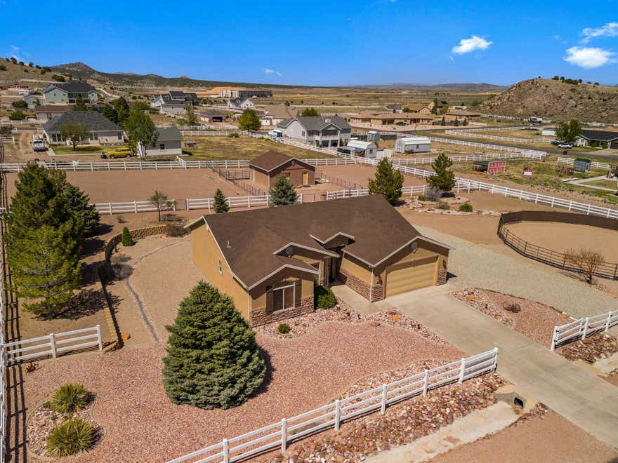 Charming, cozy single-level home set on a 1-acre horse property with breathtaking valley and mountain views--including Cedar Breaks. This well-maintained home features 2 bedrooms, 2 bathrooms, plus a front office that can easily be converted into a third bedroom, offering flexibility to fit your needs.
Designed with both comfort and functionality in mind, the property includes a tack room that can also serve as a workshop or additional storage space. Equestrian-ready, it boasts a 60-foot round pen, multiple enclosed and cross-fenced pens, panels, and a 24x24 (inside dimensions) cinder block barn/workshop complete with two horse stalls.
Meticulously cared for inside and out, pride of ownership shines throughout. Enjoy peaceful mornings and stunning sunsets from your own yard while taking in the surrounding open space. Whether you're a horse enthusiast or simply seeking a quiet retreat with room to grow, this property offers the perfect blend of country living and convenience.