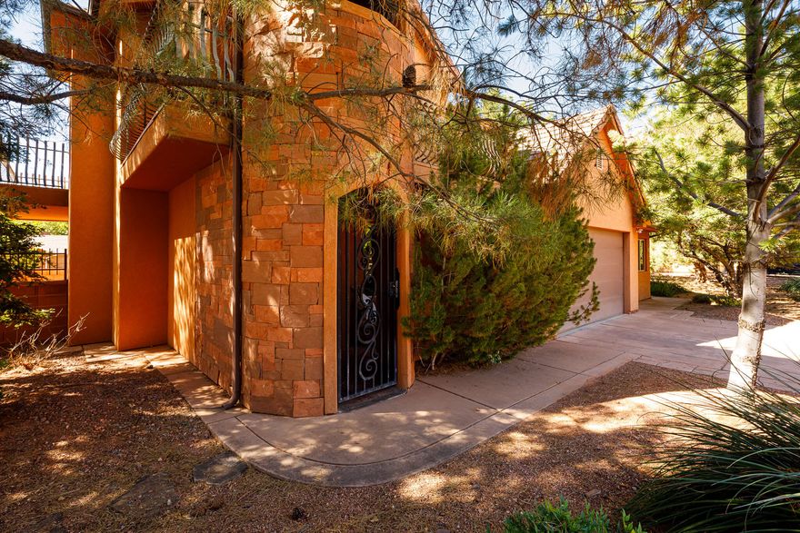 Set against the dramatic red cliffs this home has breathtaking views, and it is designed for both elegance and comfort. It has a bonus ADU/Casita as well. The homes inviting entry opens to a refined interior featuring formal living area with a fireplace, 4 bedrooms and 2.5 baths. A formal dining room with bay windows leads into the well-equipped kitchen, complete with abundant storage, newer appliances, and a pantry. The laundry room includes an upgraded washer and dryer with small-batch drawer for added convenience. Upstairs, the spacious primary suite offers a cozy fireplace, ensuite bath, and balconies with breathtaking views. An additional bedroom, full bath, and a versatile family/exercise room complete the second level. A highlight of this property is the private ADU/Casita with its own entrance, full kitchen and full bath. This is a perfect overflow, income producing or multi-generational home