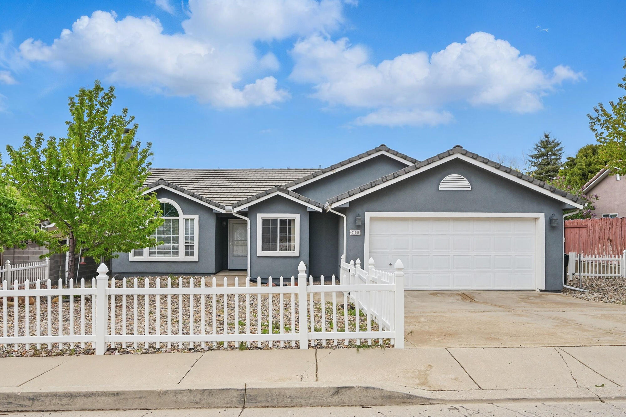 This is the home you've been looking for! So much charm, great neighborhood, great location within the city in the quiet southeast side, close to walking & biking trails and easy access to shops and restaurants! 3 beds and 2 baths plus great details like a gas fireplace, double vanity and walk-in shower in the master, low- maintenance landscaping, fencing, concrete tile roof and finally - a white picket fence in front! The only other thing better than that is NO HOA! Immaculate with a long history of good maintenance. You must see this home for yourself! This home is great for growing families, those downsizing, or investors/nightly rentals.