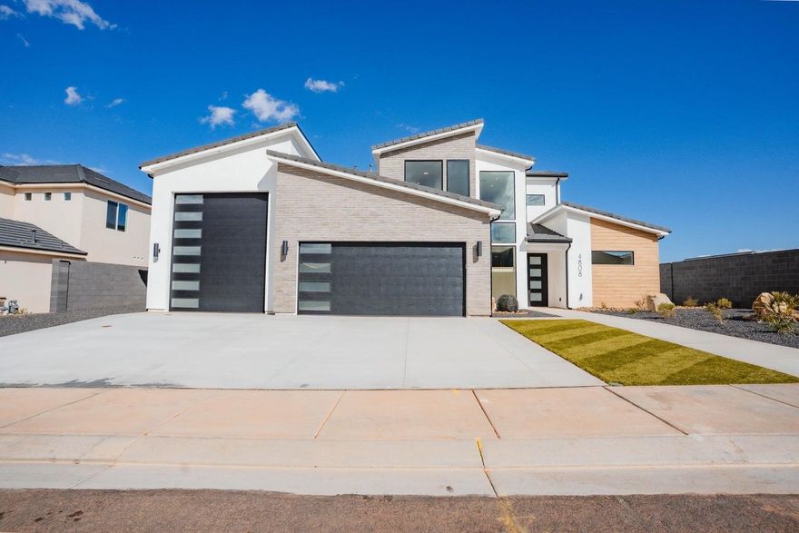 ~52' DEEP RV GARAGE~ 360 Degree Landscaping~ 

ANOTHER ONE BY BIG ROCK HOMES in the sought-after Sand Hollow Village.

 This home's stand out features is its massive 52-FOOT DEEP RV GARAGE (12' wide x 14' tall door)! Inside, you'll find an open-concept layout with LUXURY FINISHES, spacious bedrooms, and LARGE BACKYARD WITH ROOM TO ADD A POOL! 

-Ask about lender incentives!-

This property comes equipped with premium SMART HOME features including 3 wired in insecurity cameras and a door bell camera. Just minutes from Sand Hollow Reservoir, Sand Hollow Golf Course, the sand dunes, and Zion National Park, you're surrounded by year-round adventure -- boating, biking, hiking, off-roading, and more. Contact listing agent for PRIVATE SHOWINGS.
